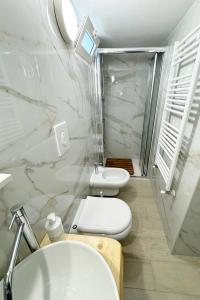 a bathroom with a toilet and a sink and a shower at Il Sentiero in Bari +31 photos