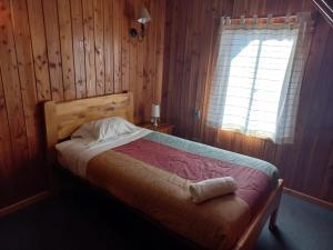 Postel nebo postele na pokoji v ubytování Alpes Hotel