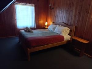 Postel nebo postele na pokoji v ubytování Alpes Hotel