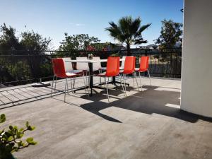 a table and chairs sitting on a patio at LalaWiGuesthouse in Langebaan