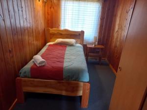 Postel nebo postele na pokoji v ubytování Alpes Hotel