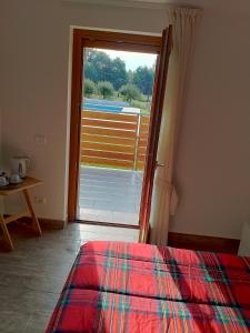 Postel nebo postele na pokoji v ubytování Agriturismo L'Antico Sapore