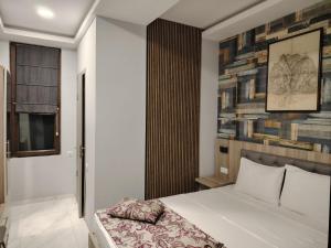 Uma cama ou camas num quarto em Vita Gardenia Hotel Tskaltubo