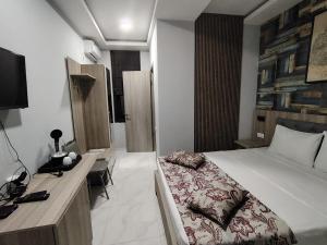 Uma cama ou camas num quarto em Vita Gardenia Hotel Tskaltubo