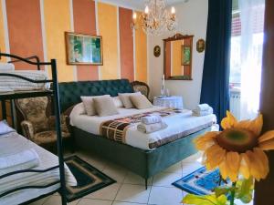 a bedroom with a bed and a flower on the floor at B&B Gardasee in Castelnuovo del Garda