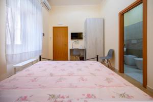 Postel nebo postele na pokoji v ubytování Il cappello sulle 23! Camere in affitto breve