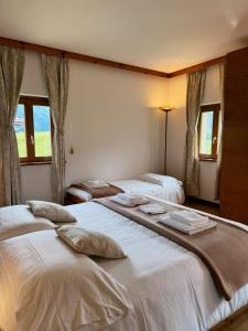 Postelja oz. postelje v sobi nastanitve Neider Hotel - Alpine Retreat Sauris