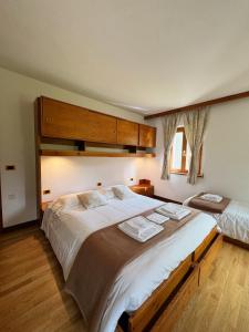 Postelja oz. postelje v sobi nastanitve Neider Hotel - Alpine Retreat Sauris