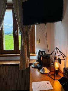 TV in/ali zabaviščno središče v nastanitvi Neider Hotel - Alpine Retreat Sauris