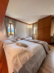 Krevet ili kreveti u jedinici u okviru objekta Neider Hotel - Alpine Retreat Sauris