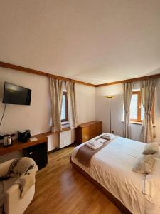Postelja oz. postelje v sobi nastanitve Neider Hotel - Alpine Retreat Sauris