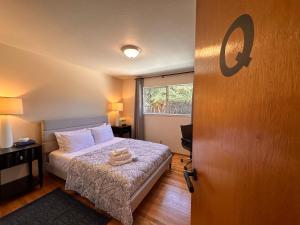 a bedroom with a bed and a window at Great Stay in South San Jose in San Jose