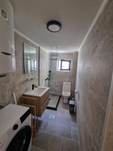 a bathroom with a sink and a toilet at Villa Regulus in Tivat +8 photos