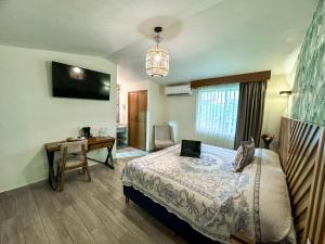 Postel nebo postele na pokoji v ubytování Hotel Isabel