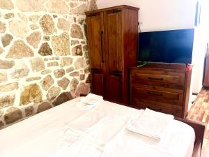 Postel nebo postele na pokoji v ubytování Jardin miraculeux