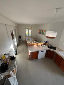 a kitchen with a sink and a counter top at La Hacienda Negra in Saint-Jouan-des-Guérets