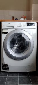 a white washing machine sitting in a kitchen at Horncastle Golf Course, Room 2 in Edlington