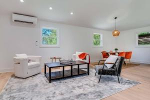 a living room with a table and chairs at New Paltz Modern Zen Cabin in New Paltz