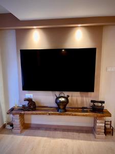 a large flat screen tv hanging on a wall at Ca La Minyona in Cardona