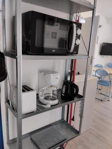 TV a/nebo společenská místnost v ubytování Appartement a la Campagne