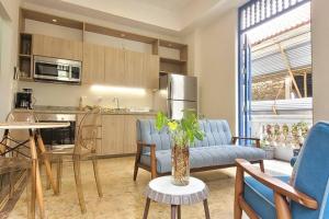 a kitchen and living room with a couch and a table at Beautiful apartment in Casco Viejo, Casa Rio Apt #2 in Panama City