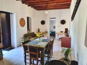 a living room with a table and chairs and a couch at Villa Christothea in Paphos