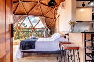 Ένα ή περισσότερα κρεβάτια σε δωμάτιο στο Le Dome Glamping - Campos do Jordão