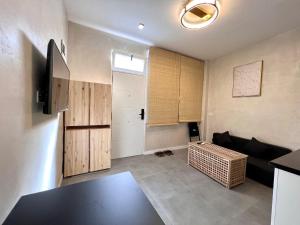 a living room with a couch and a table at Suite N25 in Madrid