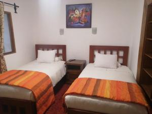 Cama o camas de una habitación en Departamentos Cusco