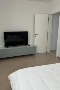 TV a/nebo společenská místnost v ubytování Isla Lux Apartment