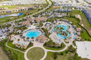an aerial view of the pool at a resort at Upstay - ChampionsGate Home w Private Pool & BBQ in Kissimmee