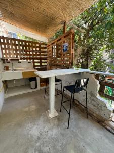 a kitchen with a table and a sink at Maze Apartments - Perfectly located brand new flats in Tel Aviv