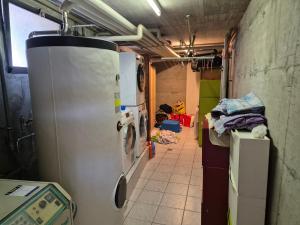 a kitchen with two refrigerators in a room at Executive Lake View with Private Garden in Lugano