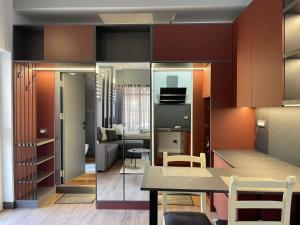 a living room with a table and a dining room at Central Charming Studio Old Town in Durrës