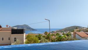 a view of the ocean from a villa at Villa cihan kalkan in Kas +2 photos