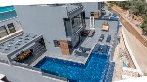 an overhead view of a house with a swimming pool at Villa cihan kalkan in Kas