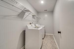 a white laundry room with a washer and dryer at Louisville Home with Large Yard 15 Mi to Downtown! in Louisville +16 photos