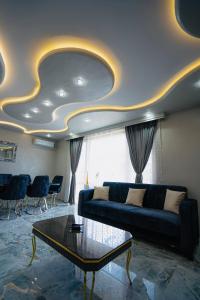 a living room with a couch and a table at AR Luxury VIP Apartments Ravda in Ravda