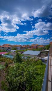 a view of a city from a balcony of a building at AR Luxury VIP Apartments Ravda in Ravda