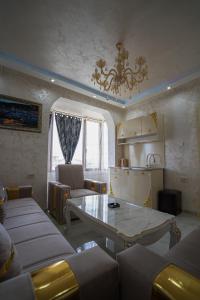a living room with a couch and a table at AR Luxury VIP Apartments Ravda in Ravda +96 photos