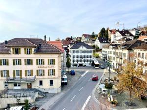 an aerial view of a city street with buildings at Beautiful One Bedroom Atelier Near City Lucerne in Ruswil +11 photos