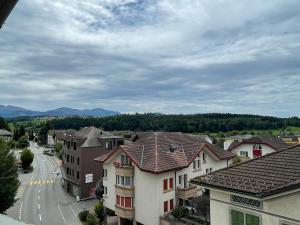 a view of a town with houses and a street at Beautiful One Bedroom Atelier Near City Lucerne in Ruswil