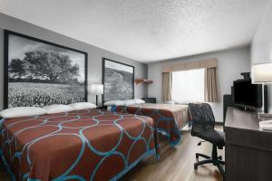 Letto o letti in una camera di Super 8 by Wyndham Grapevine/DFW Airport Northwest
