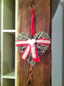 a bow on a closet door with a red ribbon at Chez les Rosset in La Salle