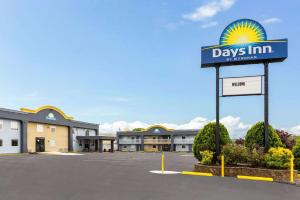 a view of a days inn sign in a parking lot at Days Inn by Wyndham Aberdeen in Aberdeen