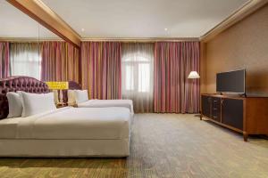Μια τηλεόραση ή/και κέντρο ψυχαγωγίας στο Grand Regency Doha, Trademark Collection by Wyndham