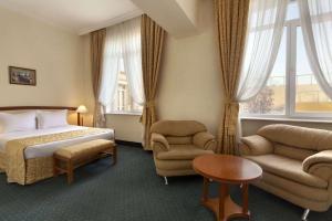 Postel nebo postele na pokoji v ubytování Ramada by Wyndham Plovdiv Trimontium