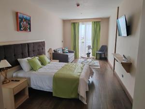 Postel nebo postele na pokoji v ubytování Hotel Puerto Limón CR