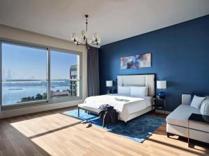 Postel nebo postele na pokoji v ubytování Rixos The Palm Hotel & Suites - Ultra All Inclusive