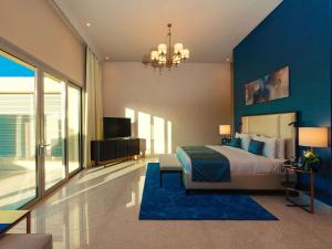 Postel nebo postele na pokoji v ubytování Rixos The Palm Hotel & Suites - Ultra All Inclusive